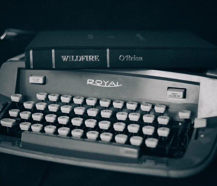 typewriter with copy of Wildfire on top